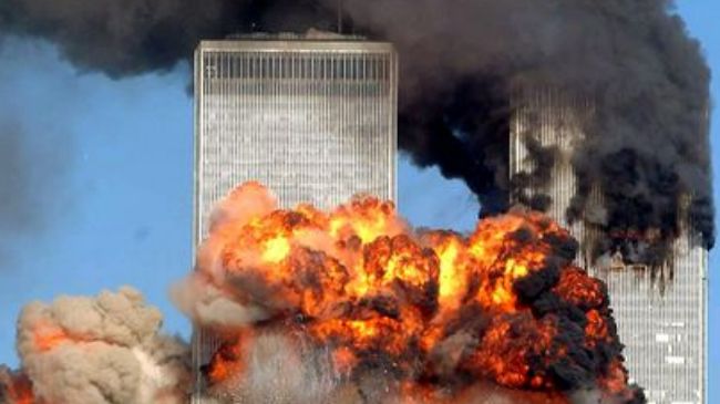 The photo shows the Twin Towers in New York on fire after planes hit them on September 11, 2001.